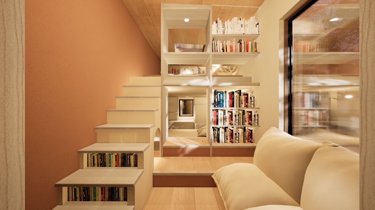 A modern interior with a staircase leading to a loft bedroom, a sofa, and built-in bookshelves.
