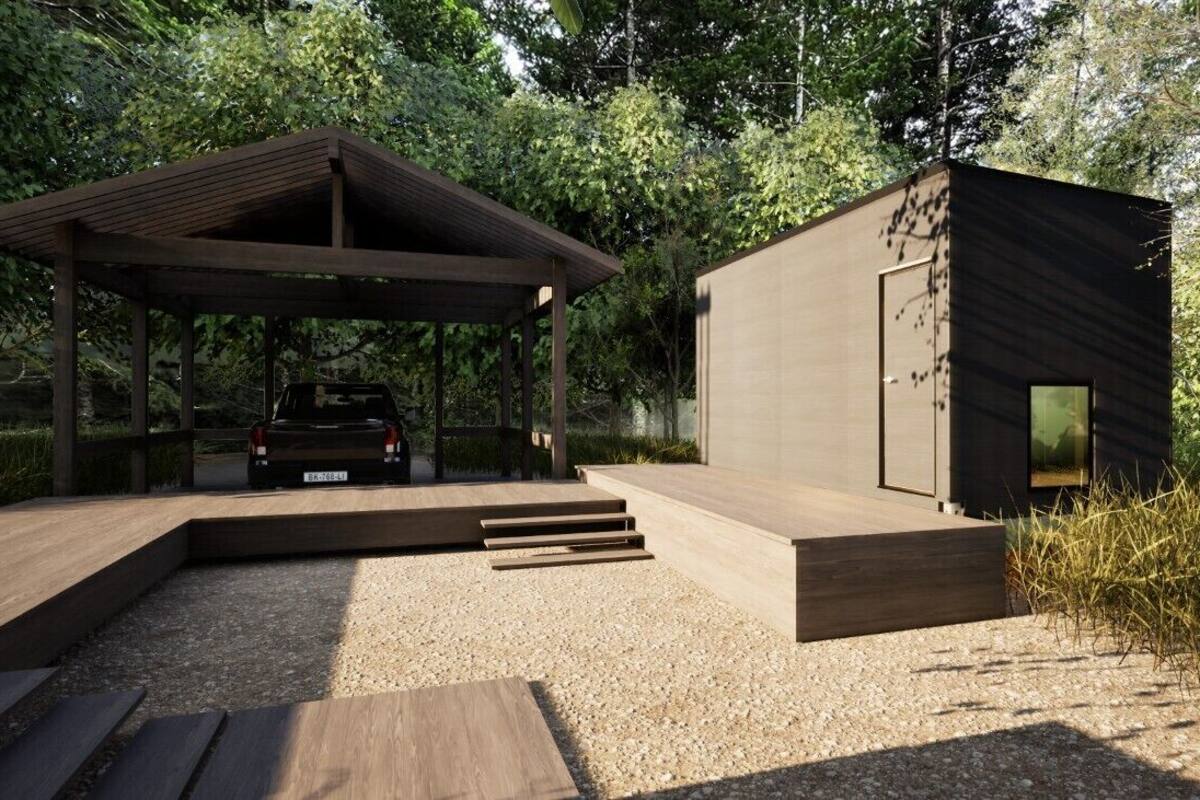 A modern outdoor structure with a car parked under a covered area, surrounded by natural vegetation.