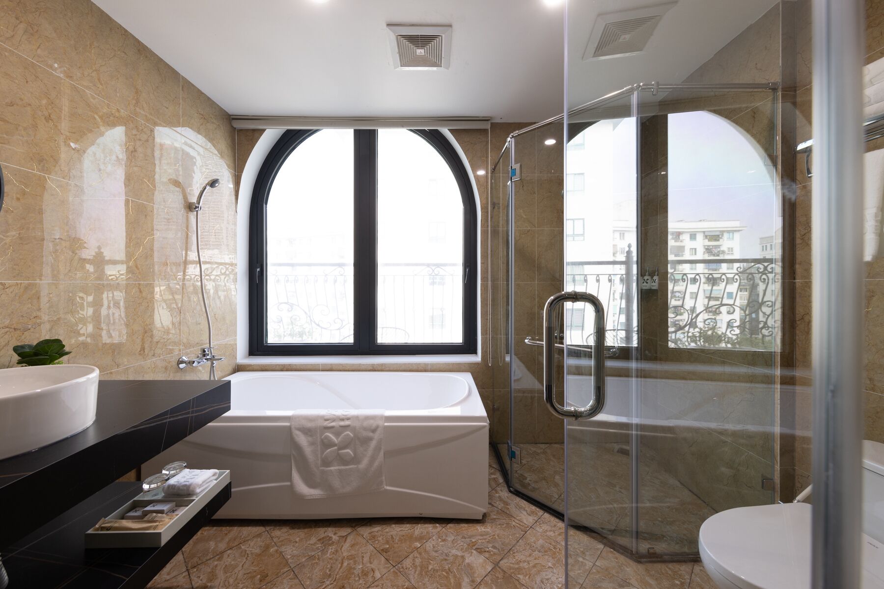 Family Triple Room, 1 Bedroom, City View | Bathroom amenities | Rainfall showerhead, designer toiletries, hair dryer, bathrobes