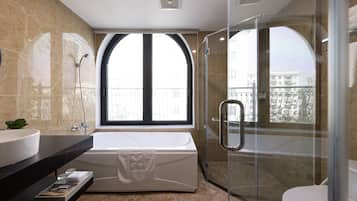 Family Triple Room, 1 Bedroom, City View | Bathroom amenities | Rainfall showerhead, designer toiletries, hair dryer, bathrobes