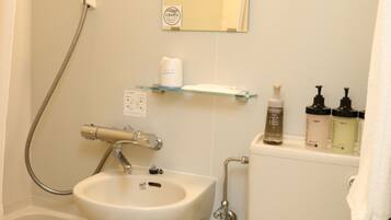 Separate bathtub and shower, hair dryer, bathrobes, slippers