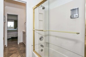 Shower, hair dryer, towels, shampoo