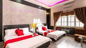 Family Room | Minibar, desk, blackout curtains, soundproofing - Tahami Hotel Thu Duc (Ho Chi Minh City)