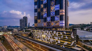 A modern building with a geometric facade and a prominent 'arte' sign. - Arte Cheras (Kuala Lumpur)