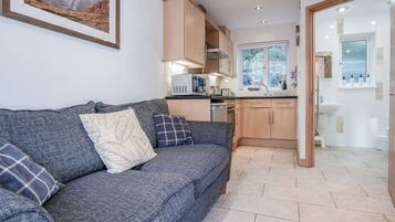 Standard Cottage | Living area | 32-inch Smart TV with cable channels