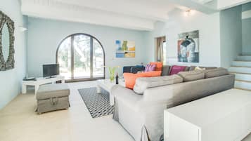 Villa | Living area | 24-inch flat-screen TV with satellite channels, DVD player