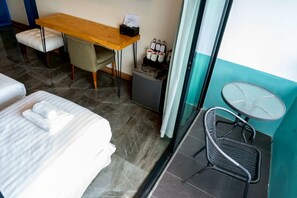 Chambre Triple Deluxe, terrasse | Coin séjour