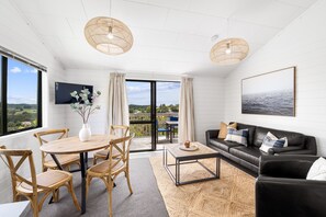 Design Cottage | Living area | Flat-screen TV - Haruru Cottages (Haruru)