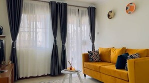Living area - Cozy Living by Miranda, Acacia, 2BDR, UnlimitedWIFI, Netflix, free parking (Kampala)