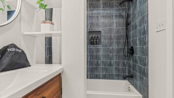 Shower, eco-friendly toiletries, hair dryer, towels