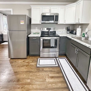 Coffee/tea maker, fridge, microwave, stovetop - Stylish 2BR in Decatur | Big Deck • Pets OK • Quiet Area (Decatur)