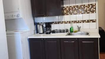 Fridge, coffee/tea maker, cookware/dishes/utensils