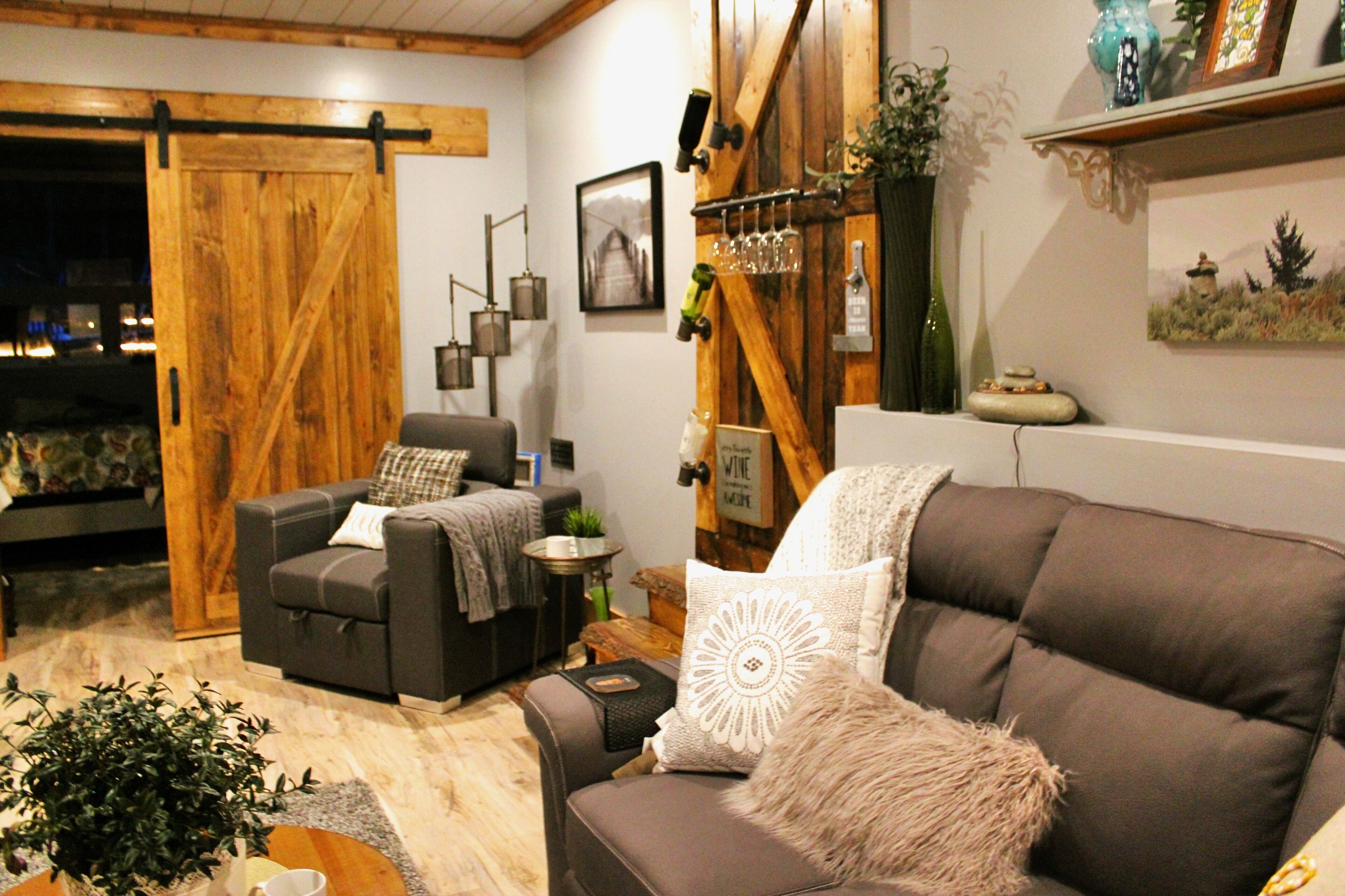 And through the Barn Door enter your cozy Bedroom with the grounds twinkling in the background.