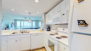 Condo, 2 Bedrooms | Private kitchen | Full-sized fridge, microwave, oven, cookware/dishes/utensils