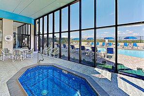 Indoor pool, outdoor pool, pool umbrellas, pool loungers