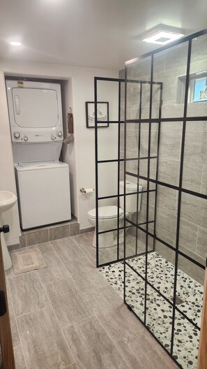 Shower, hair dryer, towels, soap