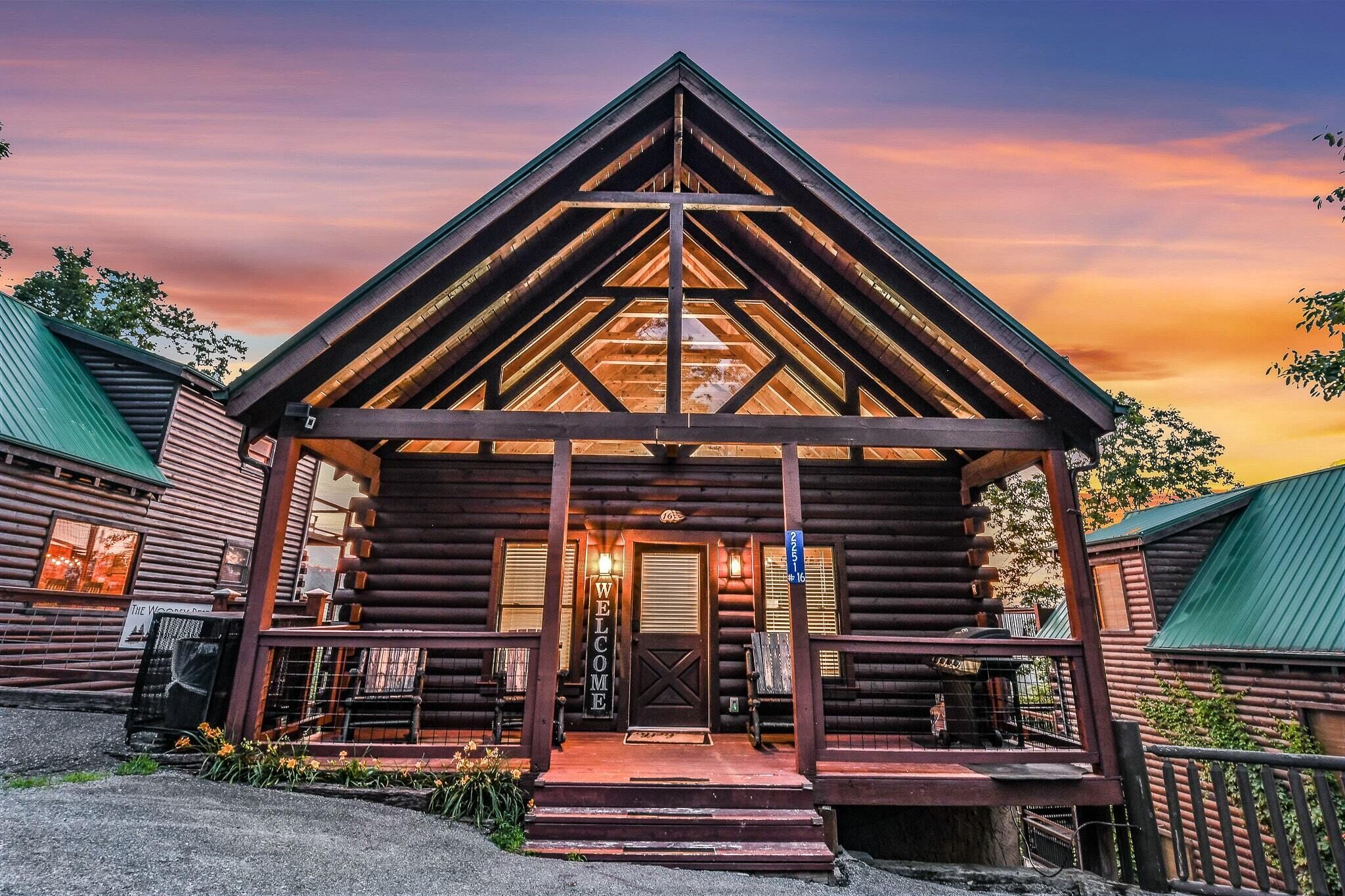 A log cabin with a welcoming entrance, a porch, and a visible signboard.