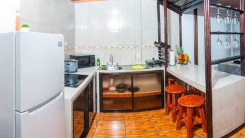 Fridge, microwave, stovetop, coffee/tea maker