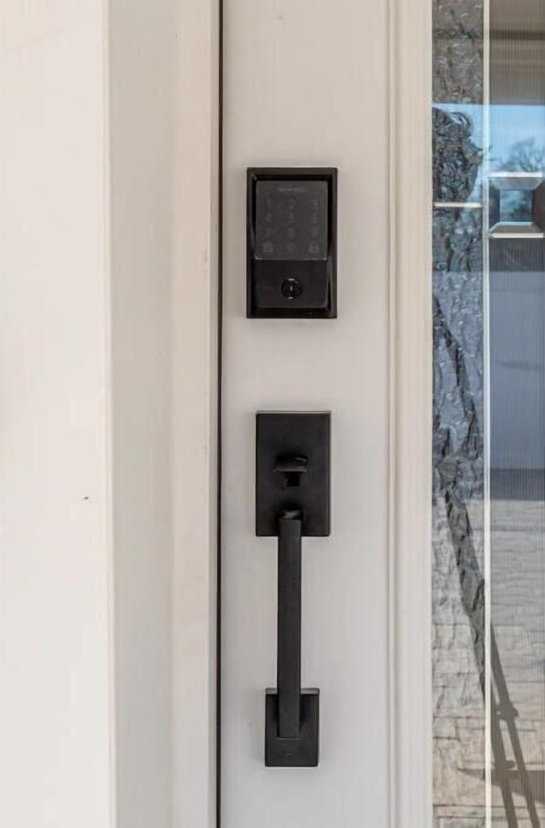 A door with a keypad lock and a keyhole.