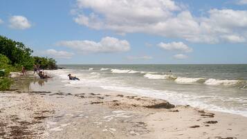 On the beach, white sand, beach towels