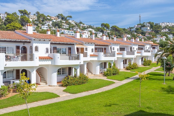 Stunning hillside architecture with balconies and a charming entrance.
