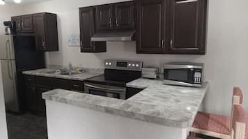 Family Apartment, Multiple Beds, Non Smoking | Private kitchen