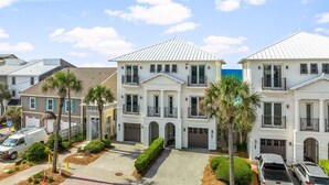 A row of white two-story houses with balconies, a paved driveway, and parked cars. - BellaVista on the Beach*HotTub*Gulf Front*3 Patios (Miramar Beach)
