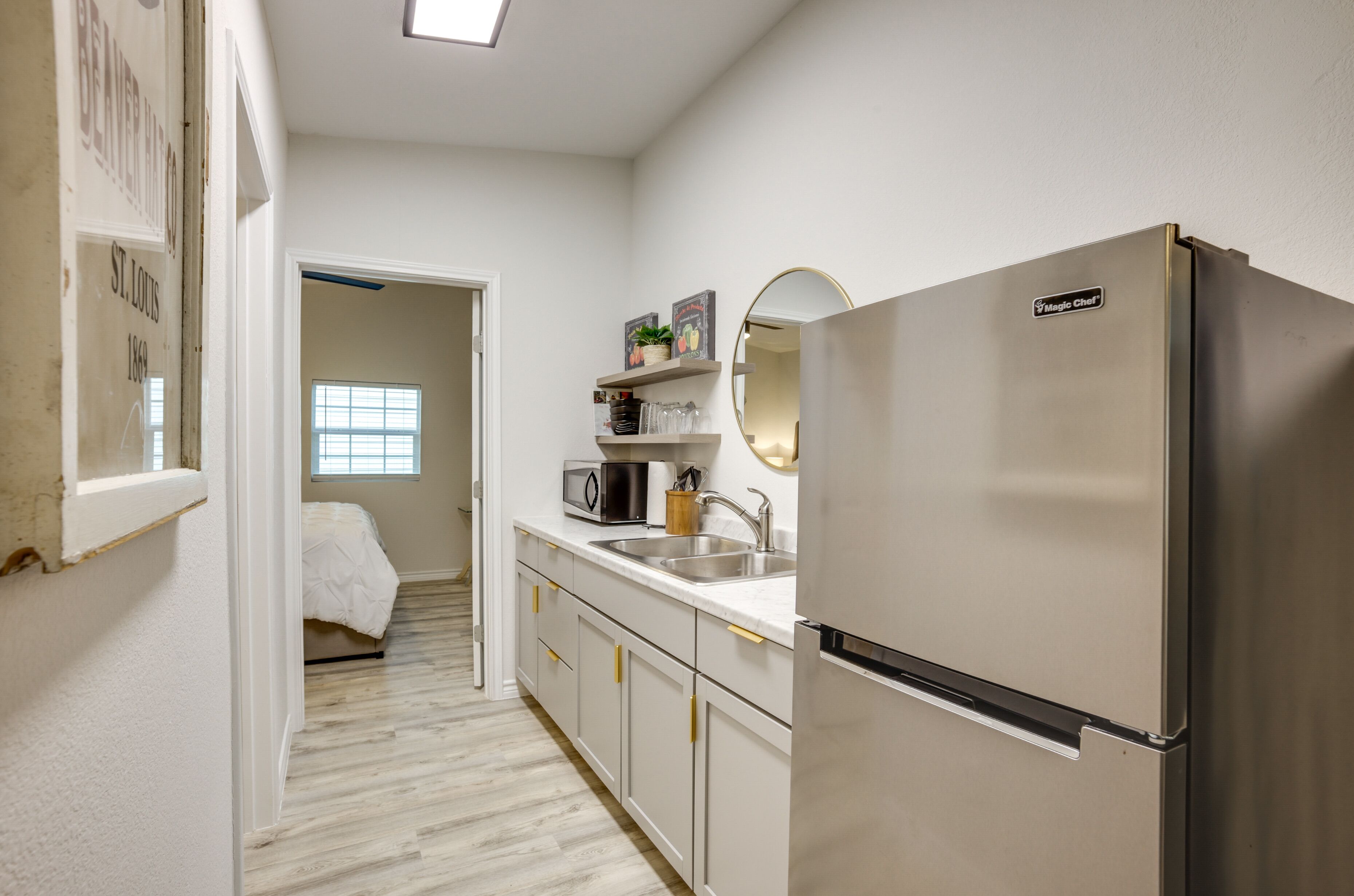 Fridge, microwave, coffee/tea maker, cookware/dishes/utensils