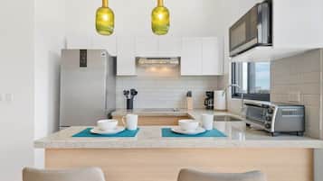 Fridge, microwave, stovetop, coffee/tea maker