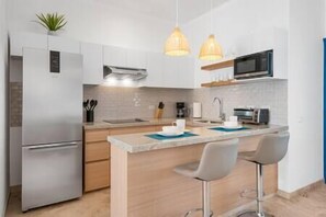 Fridge, microwave, stovetop, coffee/tea maker