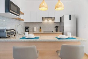 Fridge, microwave, stovetop, coffee/tea maker