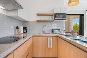 Fridge, microwave, stovetop, coffee/tea maker