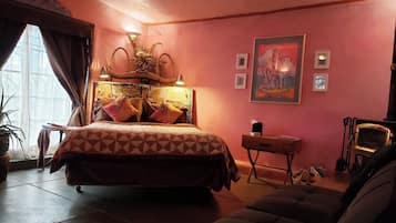 This adobe casita has a queen bed with Egyptian cotton sheets, handmade vintage quilts and a cozy wood stove.