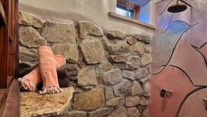 A stone wall with a bench and a small window. - Romantic, Rock Carriage House, Hot Tub, Woodstove, Kitchen on Historic Property (Los Cerrillos)