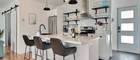 Fridge, stovetop, dishwasher, coffee/tea maker