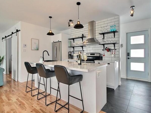 Fridge, stovetop, dishwasher, coffee/tea maker