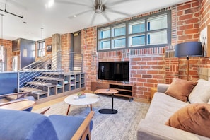 Penthouse Apartment | Living area | 55-inch Smart TV with digital channels, Netflix, Hulu - The Maverick, powered by Placemakr - River Walk (San Antonio)