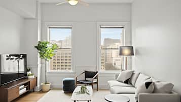 One Bedroom Apartment | Living area | 55-inch Smart TV with digital channels, Netflix, Hulu