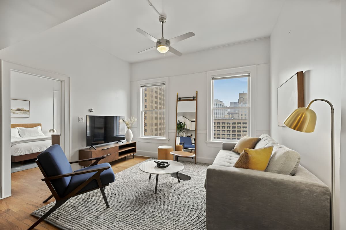 Premium One Bedroom Apartment | Living area | 55-inch Smart TV with digital channels, Netflix, Hulu