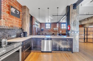 Penthouse Apartment | Private kitchen | Full-sized fridge, microwave, stovetop, coffee/tea maker