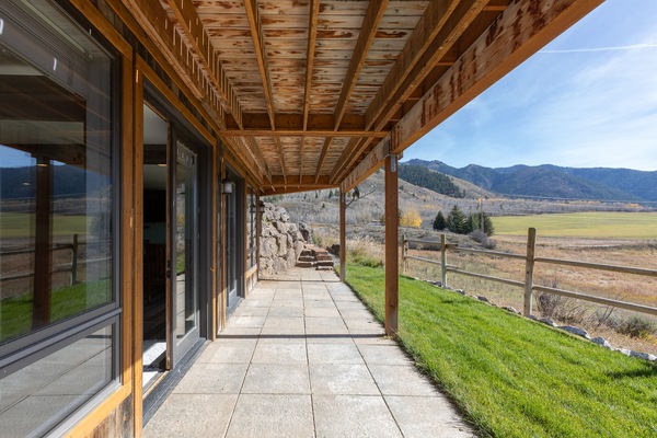 Covered back patio with hot tub access