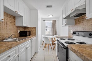 Exclusive Apartment | Private kitchen | Full-sized fridge, microwave, oven, stovetop