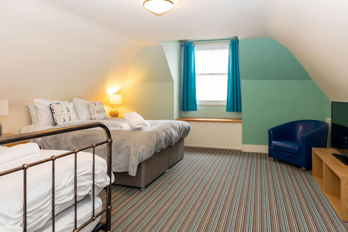 Standard Quadruple Room, Sea View | 1 bedroom, pillowtop beds, individually decorated