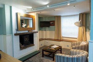 Exclusive Suite, Sea View, Ground Floor | Pillow-top beds, desk, laptop workspace, blackout curtains