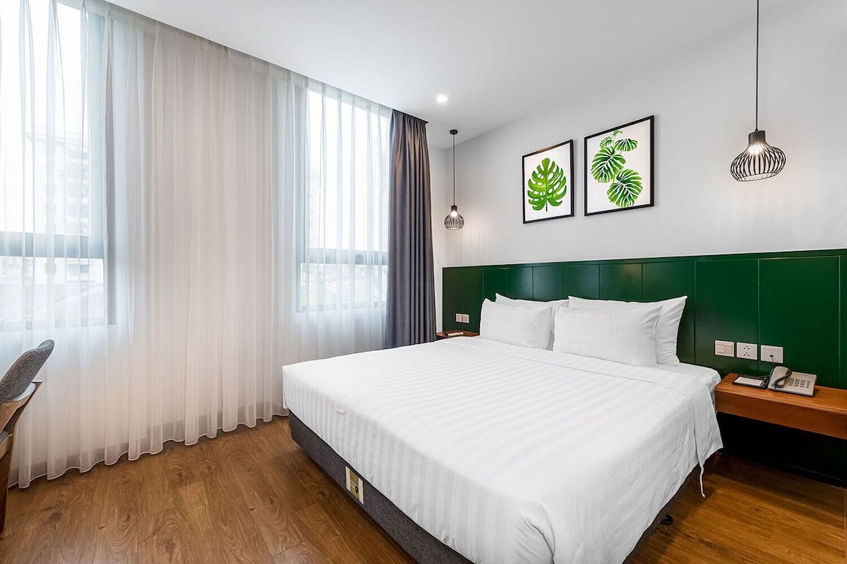 Habitación ejecutiva | Ropa de cama hipoalergénica, edredón y artículos del minibar gratis