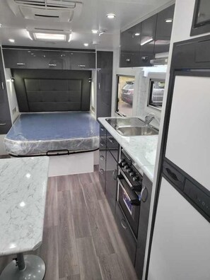 Deluxe Studio | Private kitchen | Fridge, microwave, stovetop, electric kettle