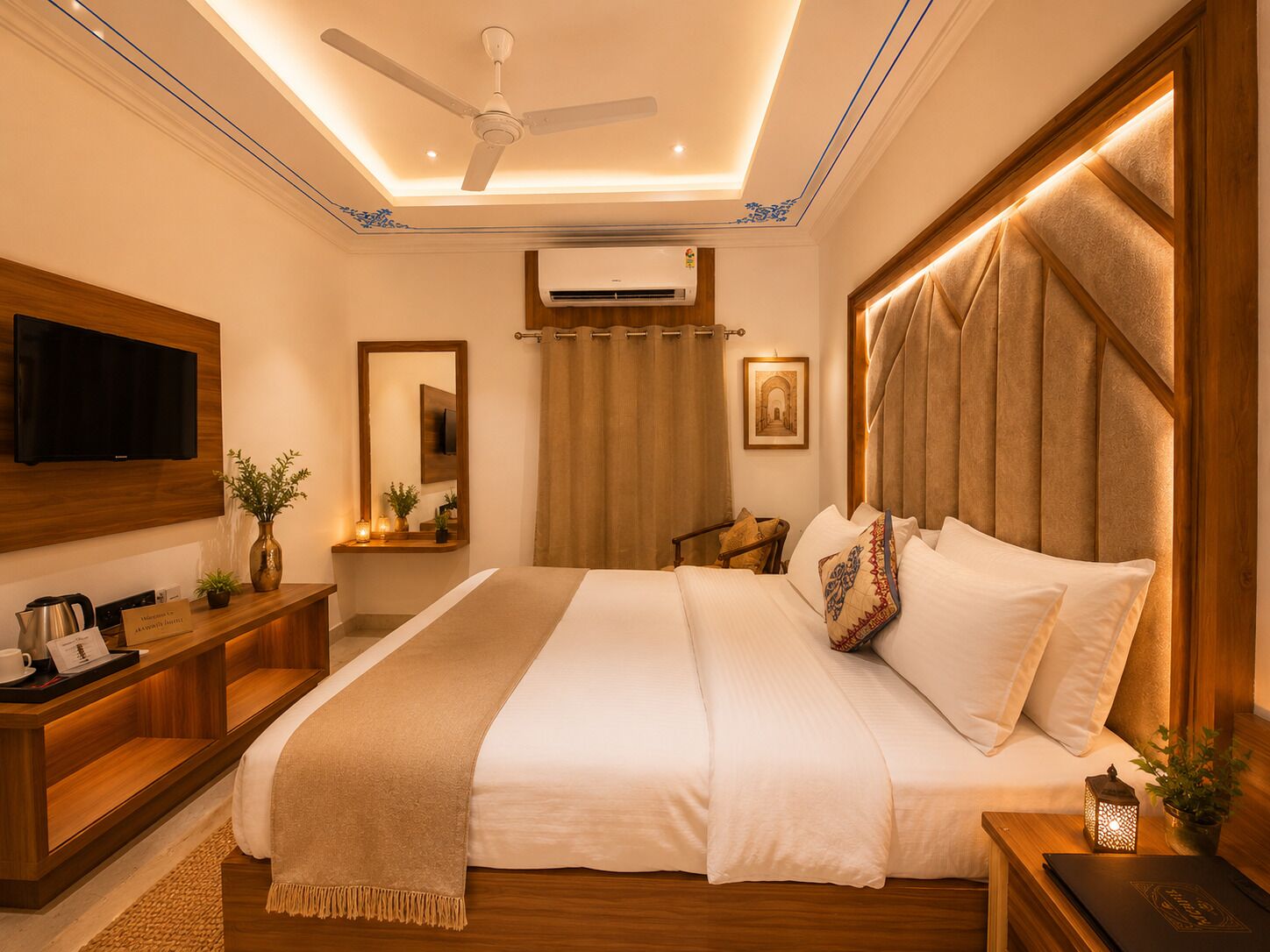 A bedroom with a bed, a TV, a desk, a mirror, a ceiling fan, and an air conditioning unit.