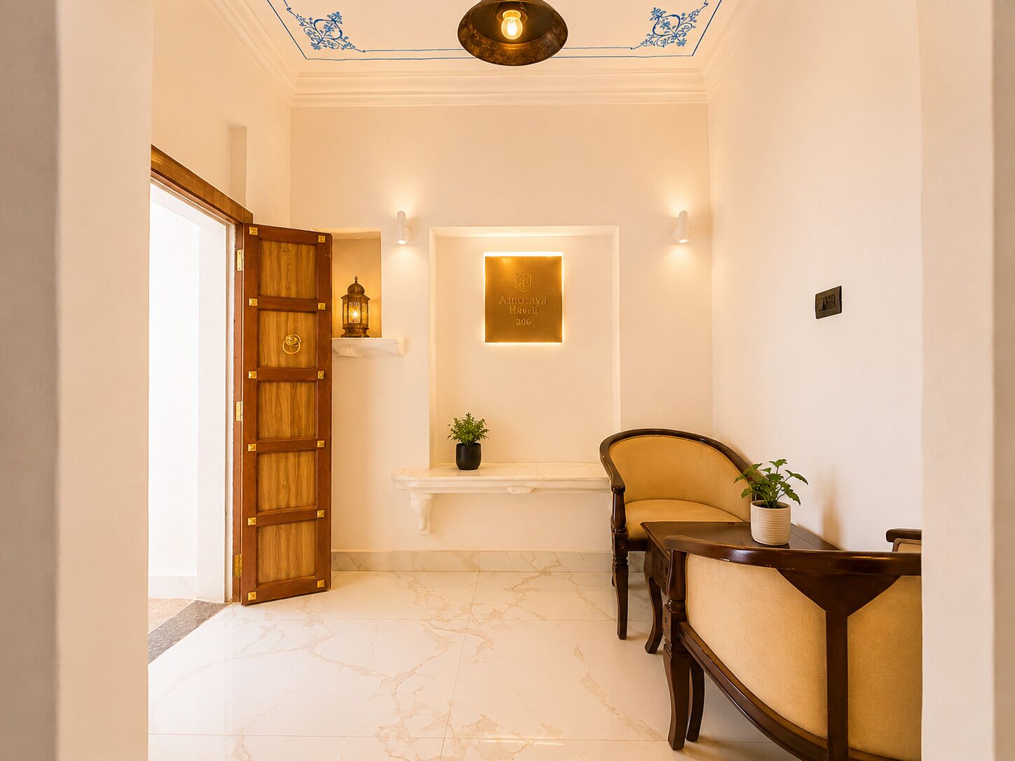 A hallway with a wooden door, a wall-mounted light fixture, a small shelf with a plant, and a chair.