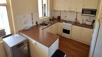 Fridge, toaster, cookware/dishes/utensils