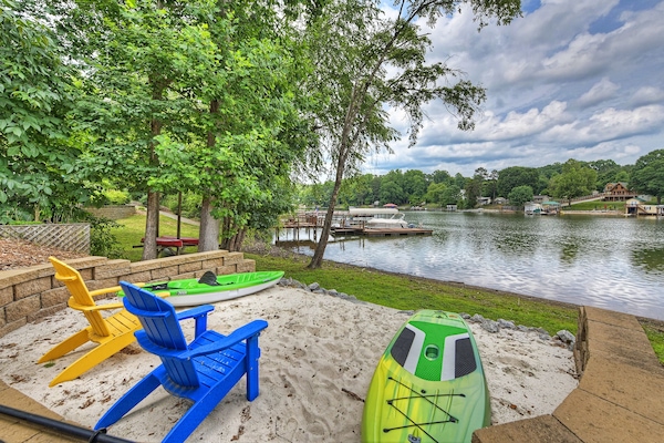 Sandy beach, with lake access and kayaks & paddle boards for guests use!